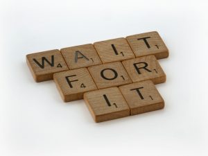 a scrabble of words that spell out wait for it